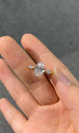 A unique three-stone diamond ring featuring an oval lab-grown diamond—dazzlingly brilliant, Color D, Clarity VS1