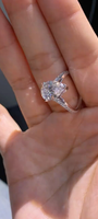 Pear-shaped lab-grown diamond ring, featuring a V-shaped band design; Color: D, Clarity: VS1